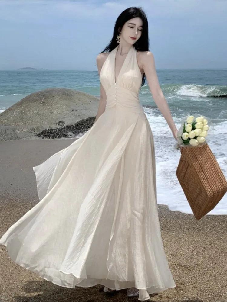 Elegant White Maxi Dress: Halter Gown for Summer Beach Wedding - Shop Now Trendy Floral Print Maxi Dress Elegant White Maxi Dress: Halter Gown for Summer Beach Wedding - Shop Now Trendy Floral Print Maxi Dress