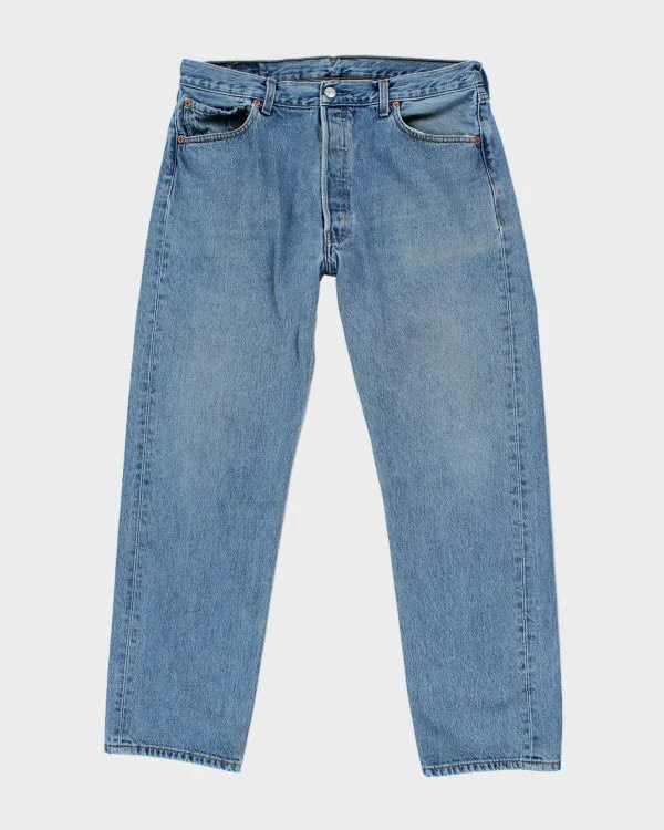 Vintage Levi's 501 Medium Wash Jeans - W34 L30 Chic Ripped Jeans